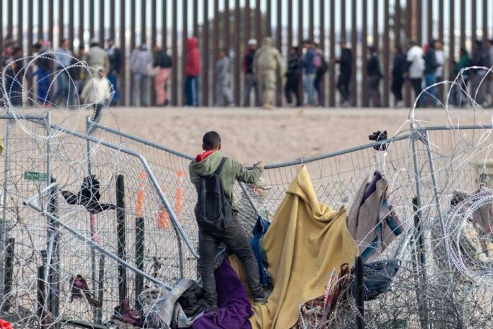 2497167515 featured image Daring Border Rescue: Migrants Stranded Atop U.S.-Mexico Barrier