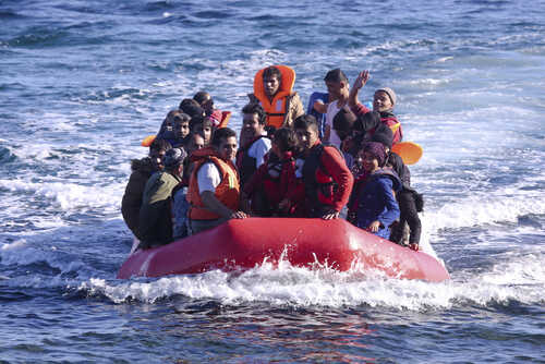 shutterstock_356234162.jpg A group of people in a red inflatable boat on the ocean