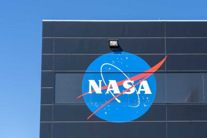 NASA logo displayed on a building against a clear blue sky