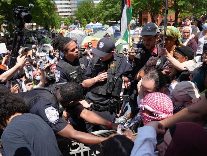 Police officers interacting with a crowd during a protest
