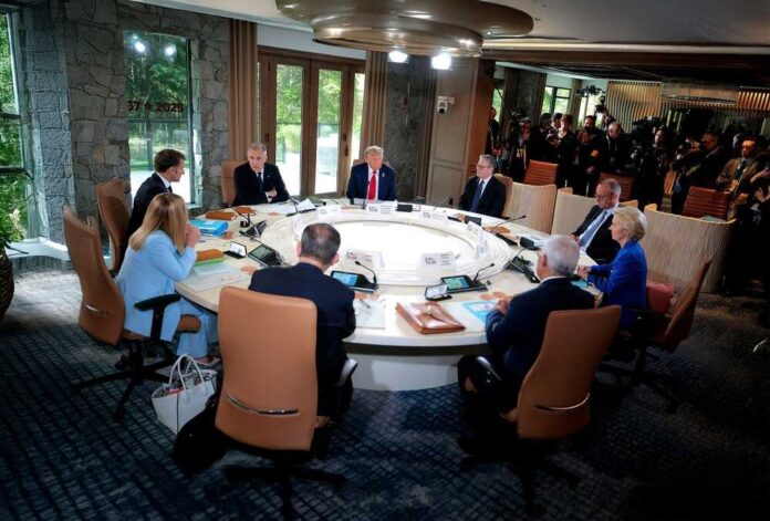 Political leaders seated around a round table during a summit meeting