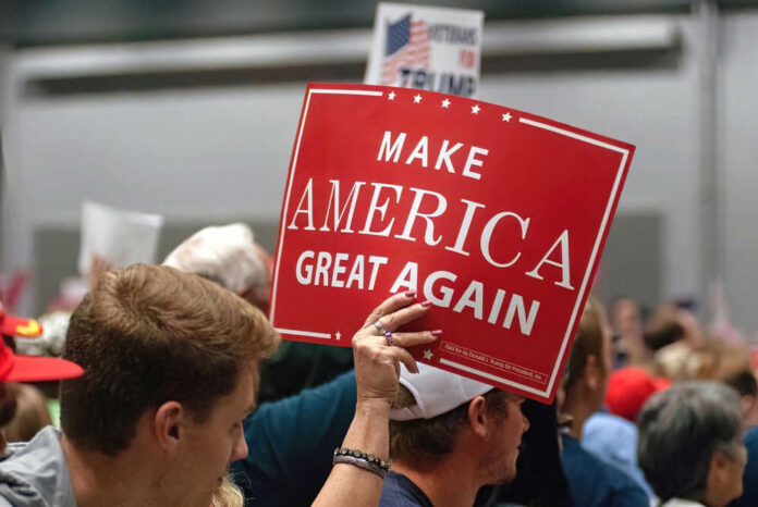 2434816525 Person holding Make America Great Again sign