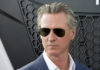 Man wearing sunglasses with a serious expression