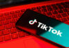 TikTok Bounty Sparks FBI Manhunt: $45,000 Smartphone with TikTok logo on red laptop keyboard