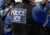 NYPD Officers ATTACKED, Deported Criminal Returns Close-up of a police officers uniform with POLICE ICE on the back