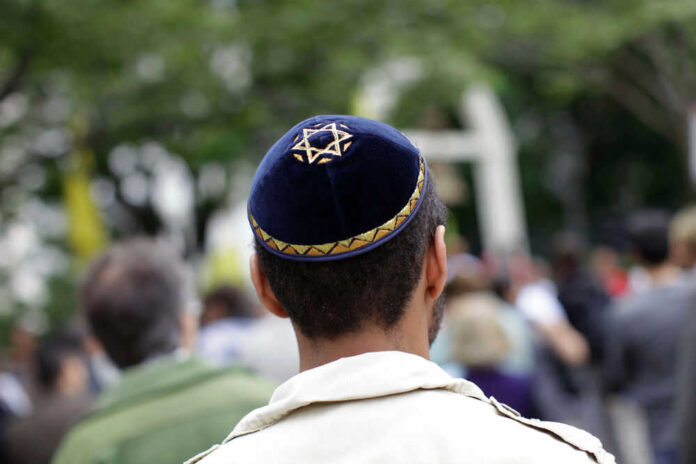 Person wearing a velvet kippah with Star of David