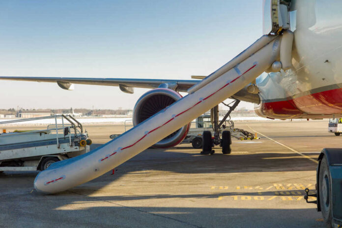 Airplane emergency slide deployed on airport tarmac