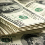 Stack of hundred dollar bills in closeup view