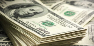 Stack of hundred dollar bills in closeup view