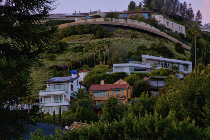 Houses on a lush hillside with modern architecture