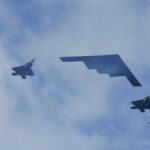 Military Shock: F-15EX Fleet Grows Amid Global Tensions Five military aircraft flying in formation under clouds